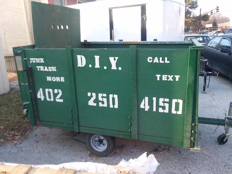 A DIY trailer that is available to rent for junk removal